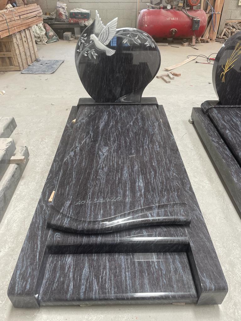 Silk Blue monument with carved dove headstone