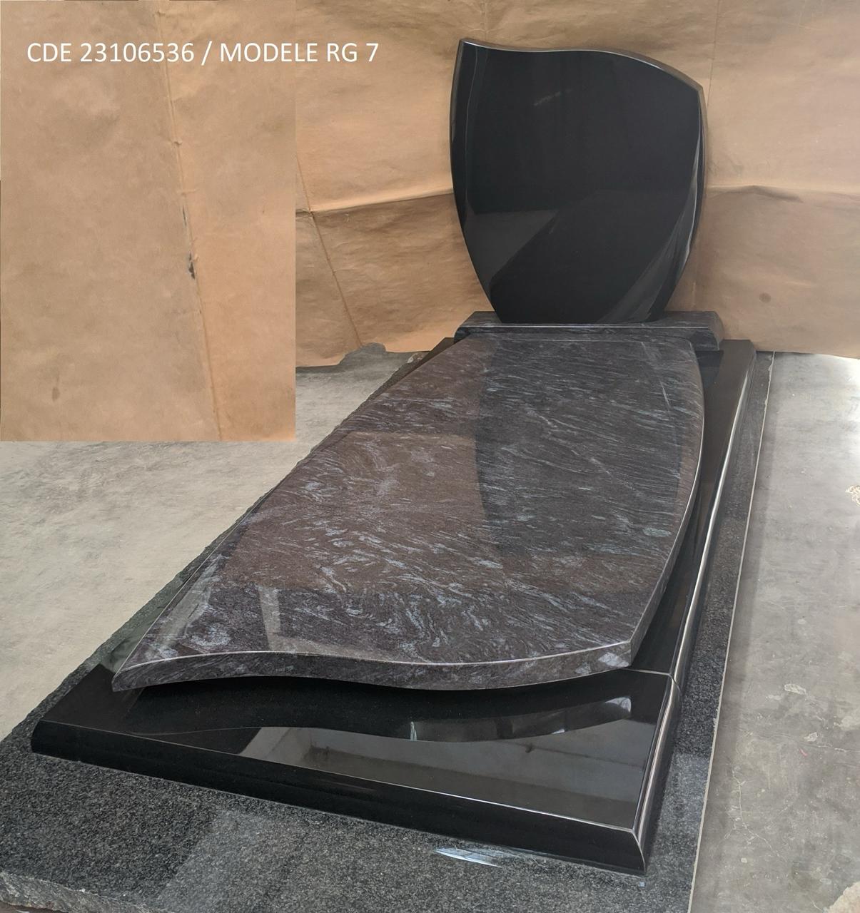 Finished Silk Blue monument with curved cover and black granite headstone