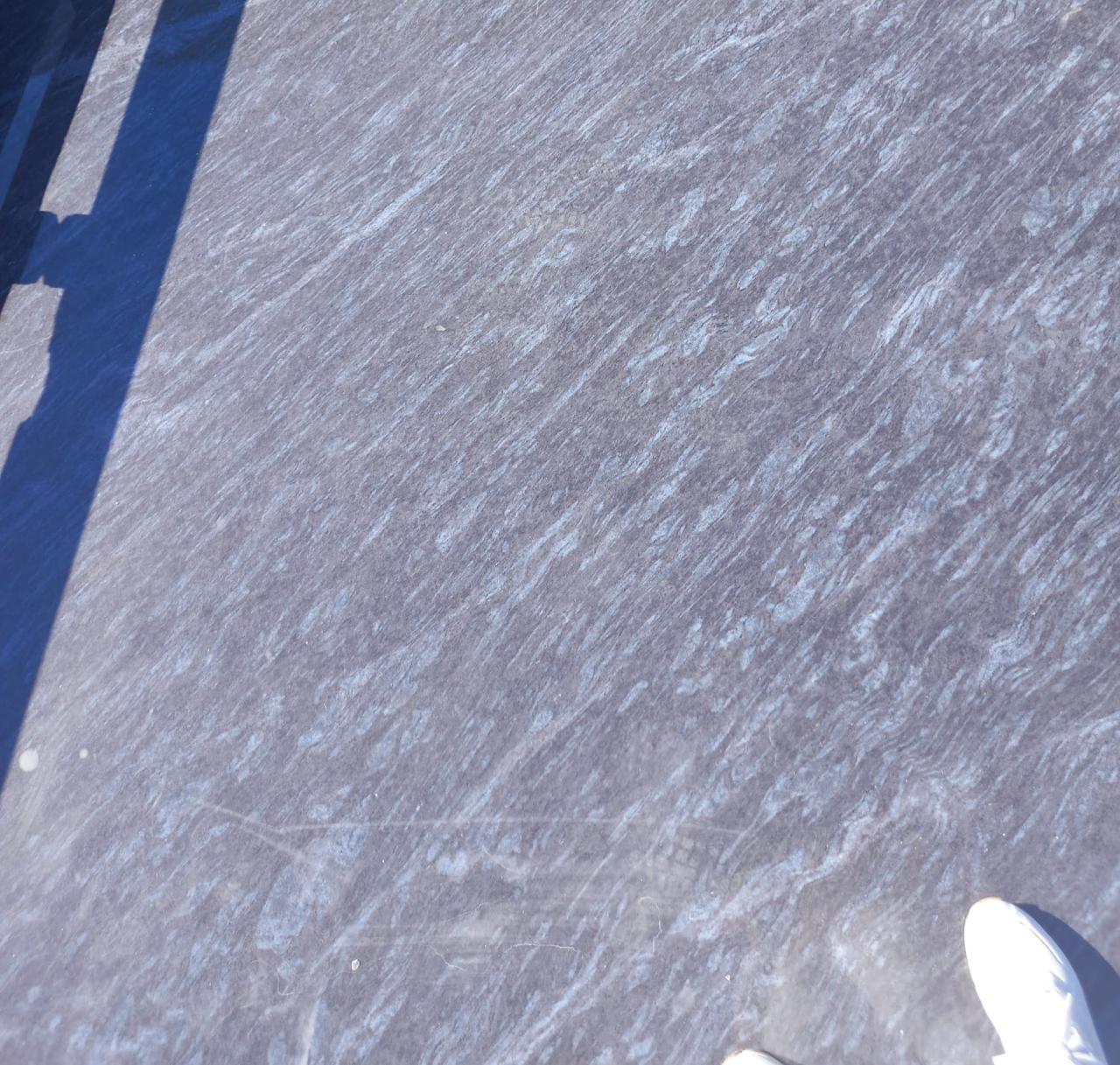Close-up of Silk Blue granite showing silver veining on a blue-grey ground